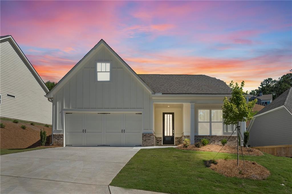 a front view of a house with a yard