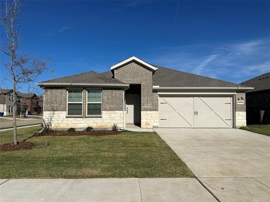 a house with yard in front of it