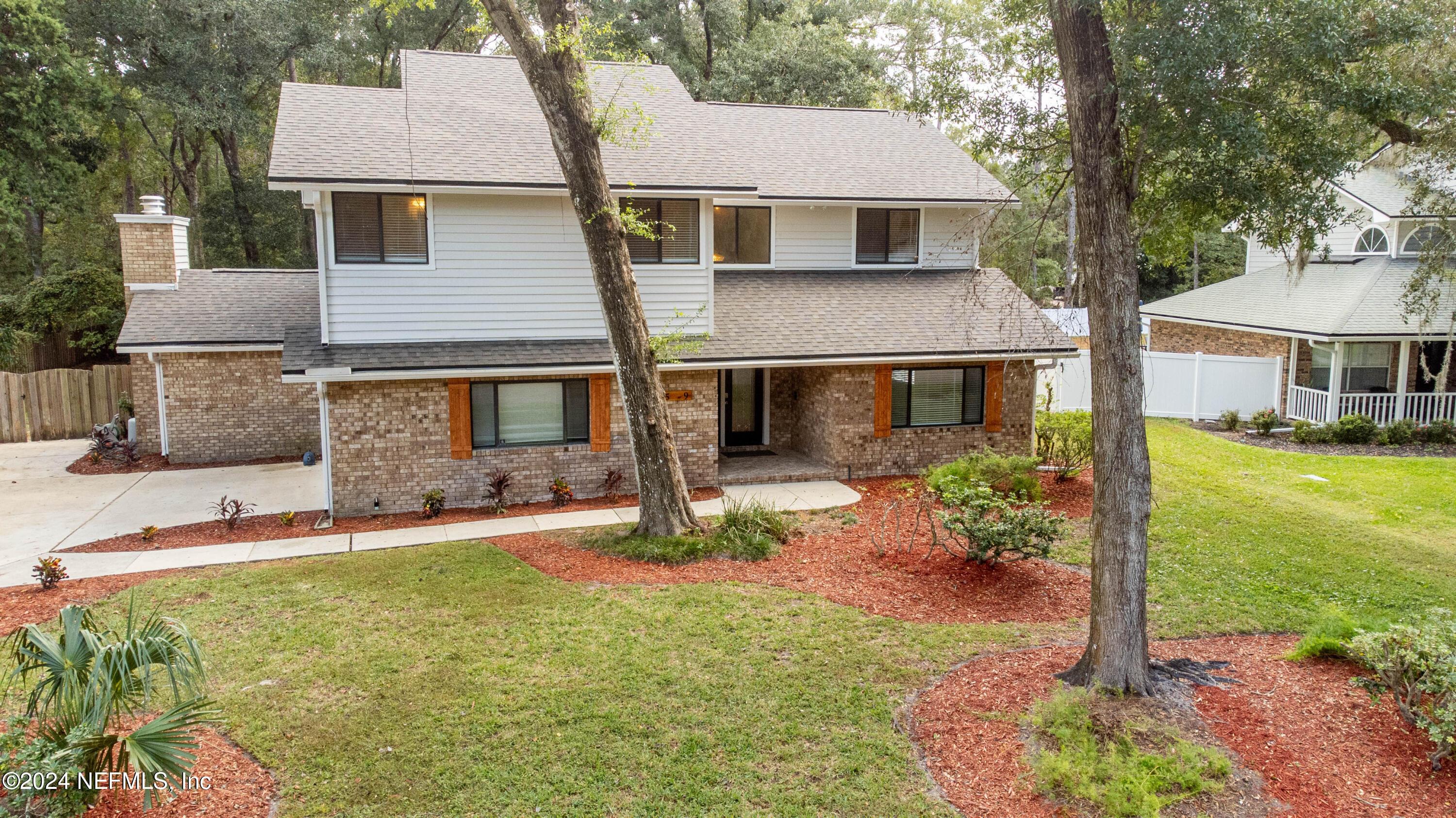 front view of a house with a yard