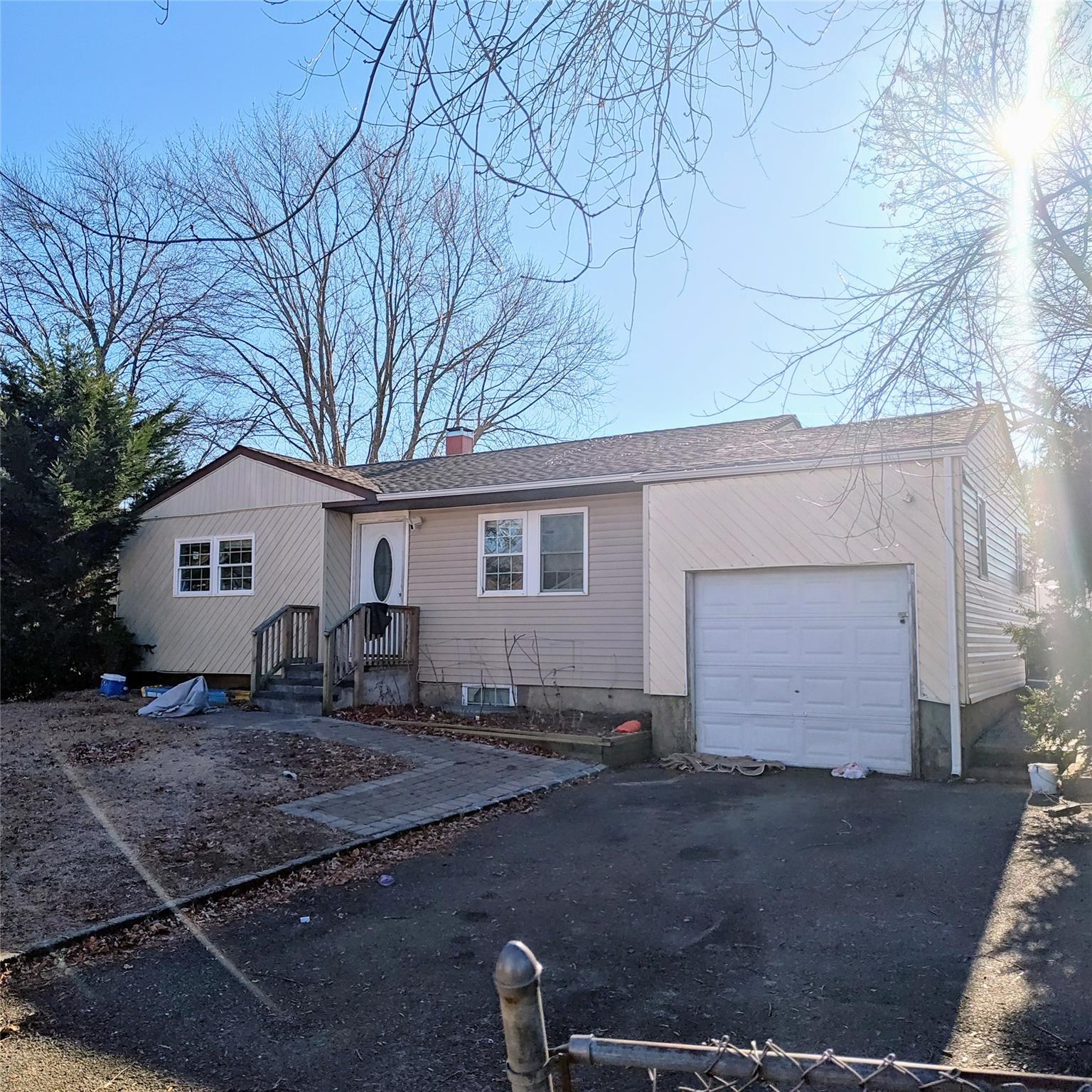 Single story home featuring a garage