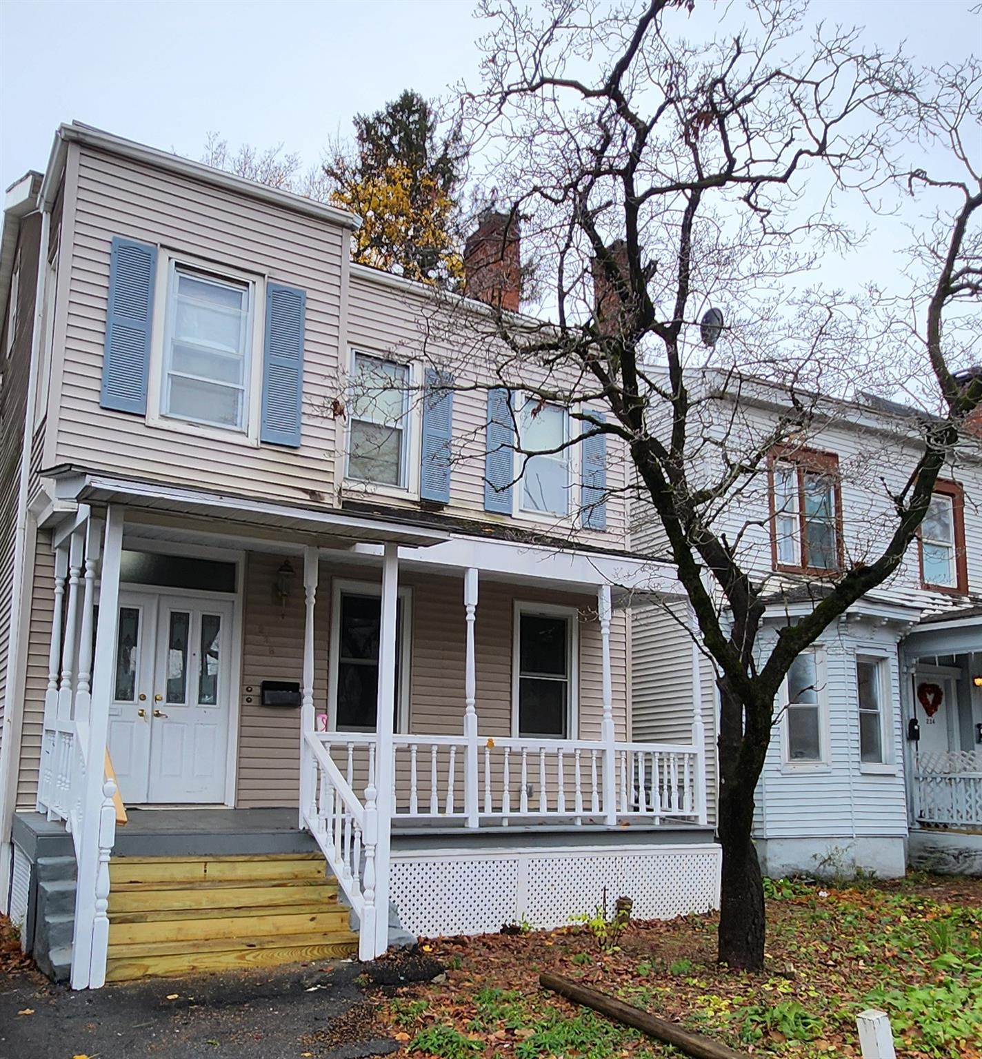 a front view of a house with a yard