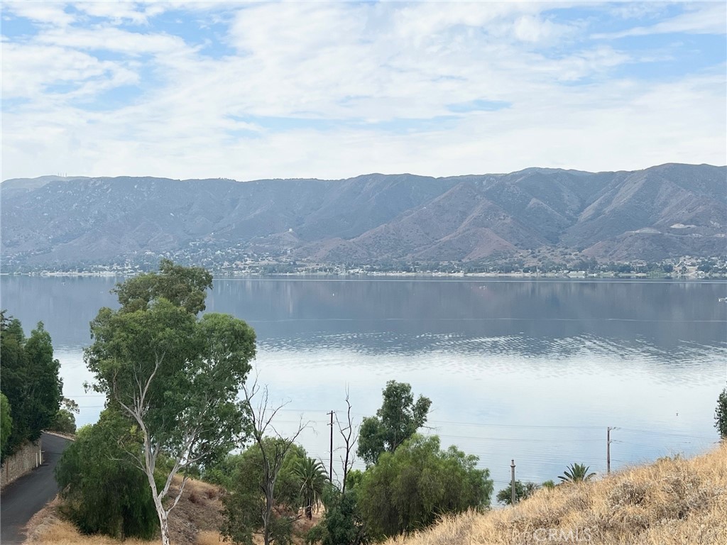 an aerial view of lake and mountain