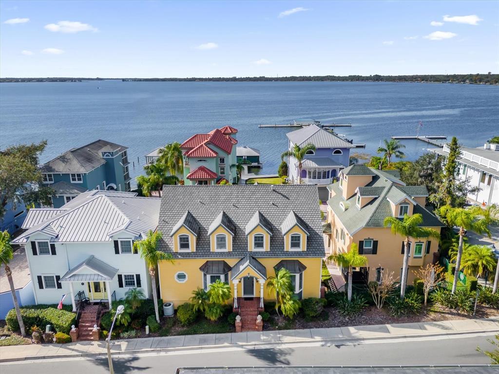 Front view of house with Lake Dora in view