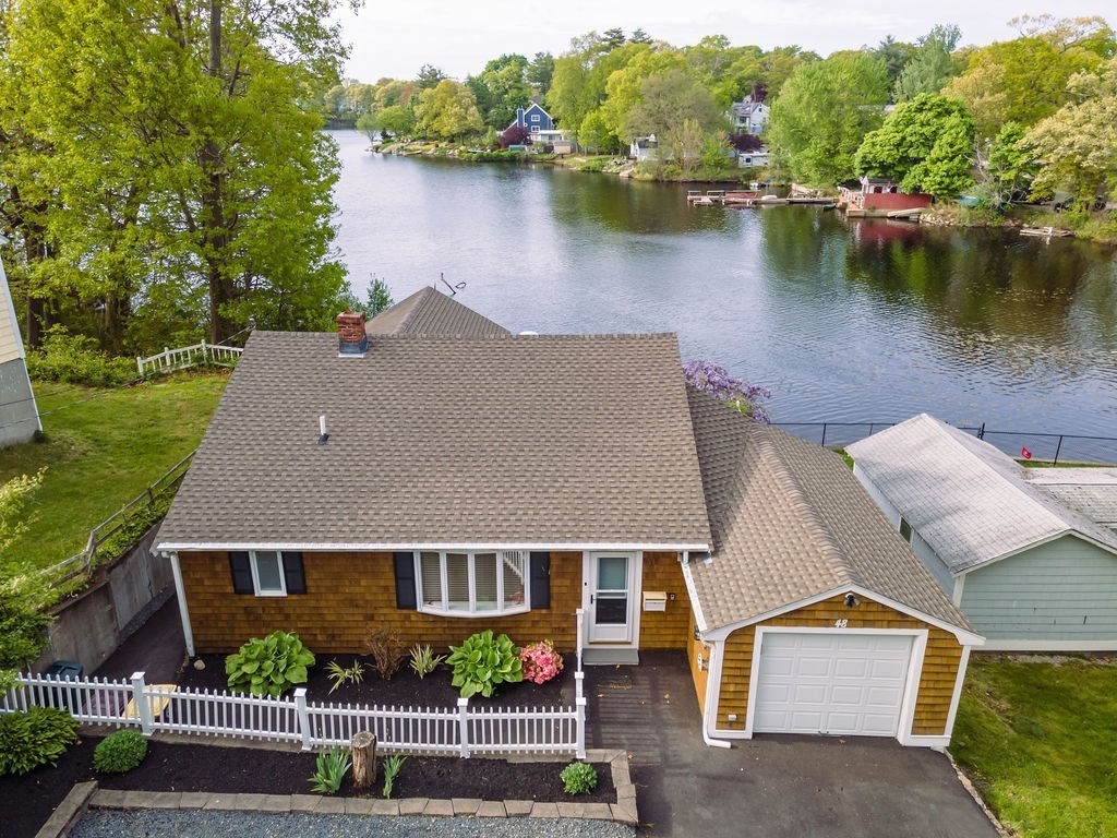 an aerial view of a house with lake view