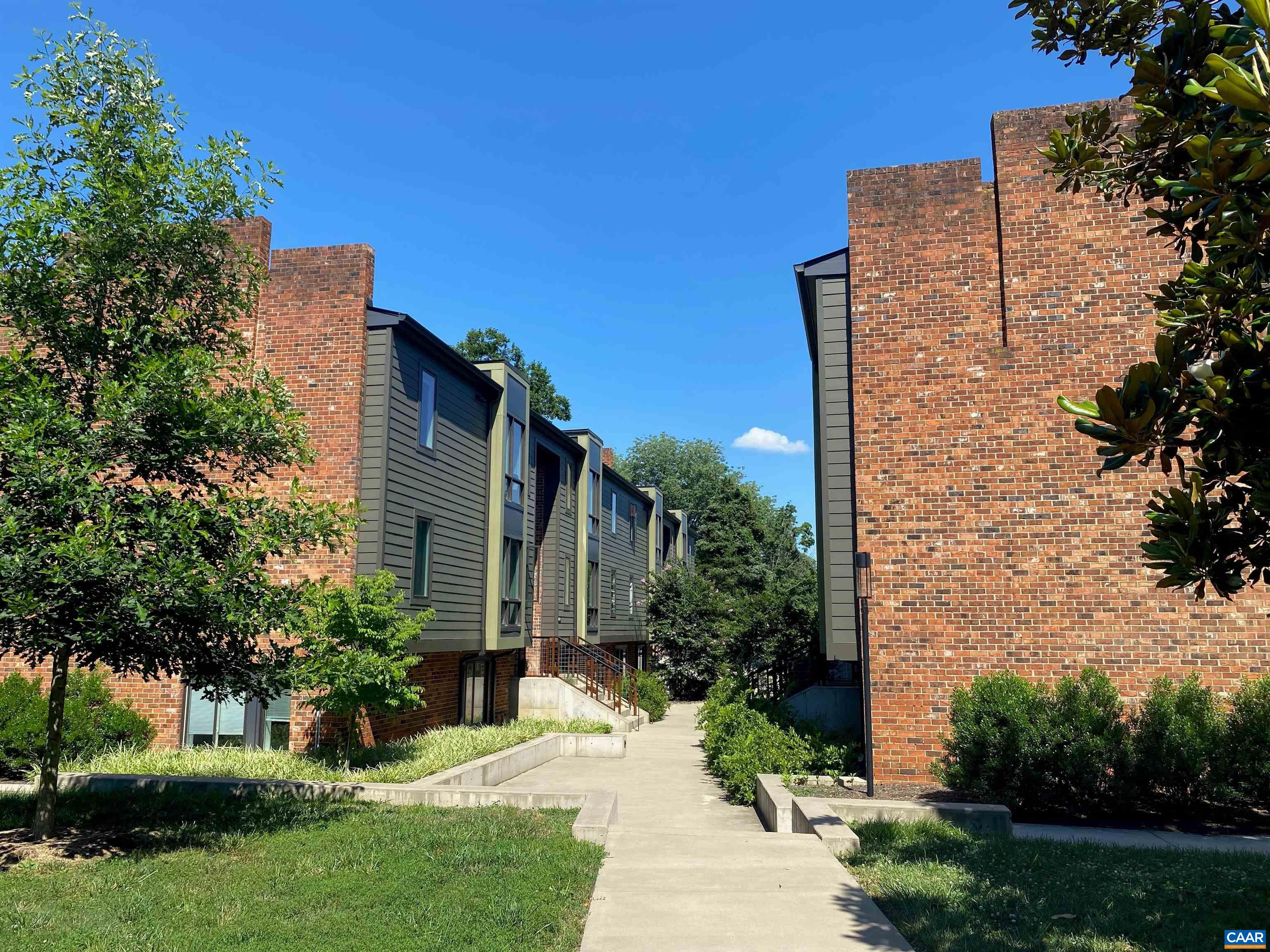 a view of a building with a yard