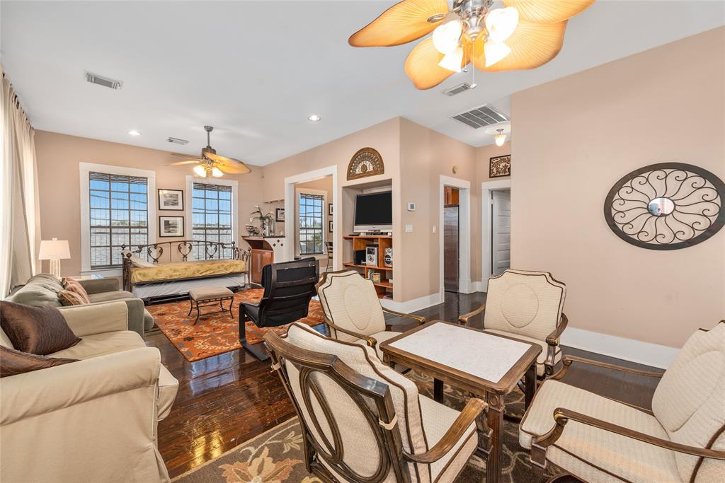 a living room with furniture a rug and a chandelier