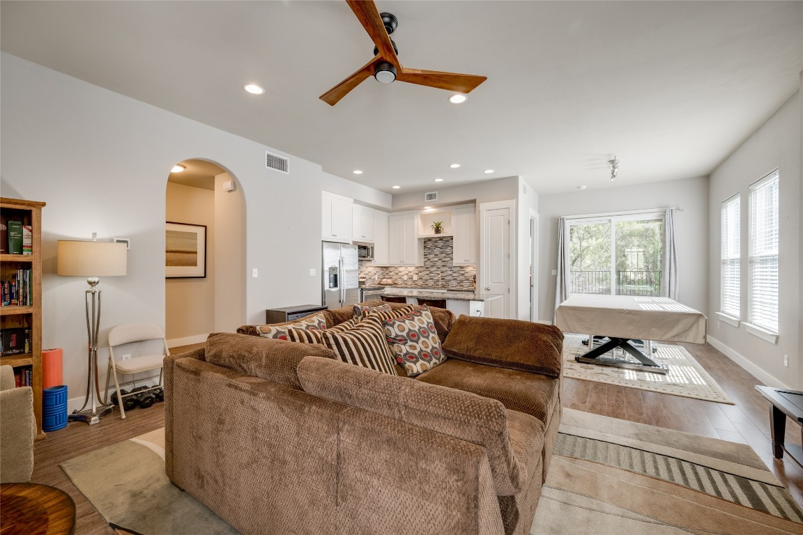 Open living area with designer light fixtures