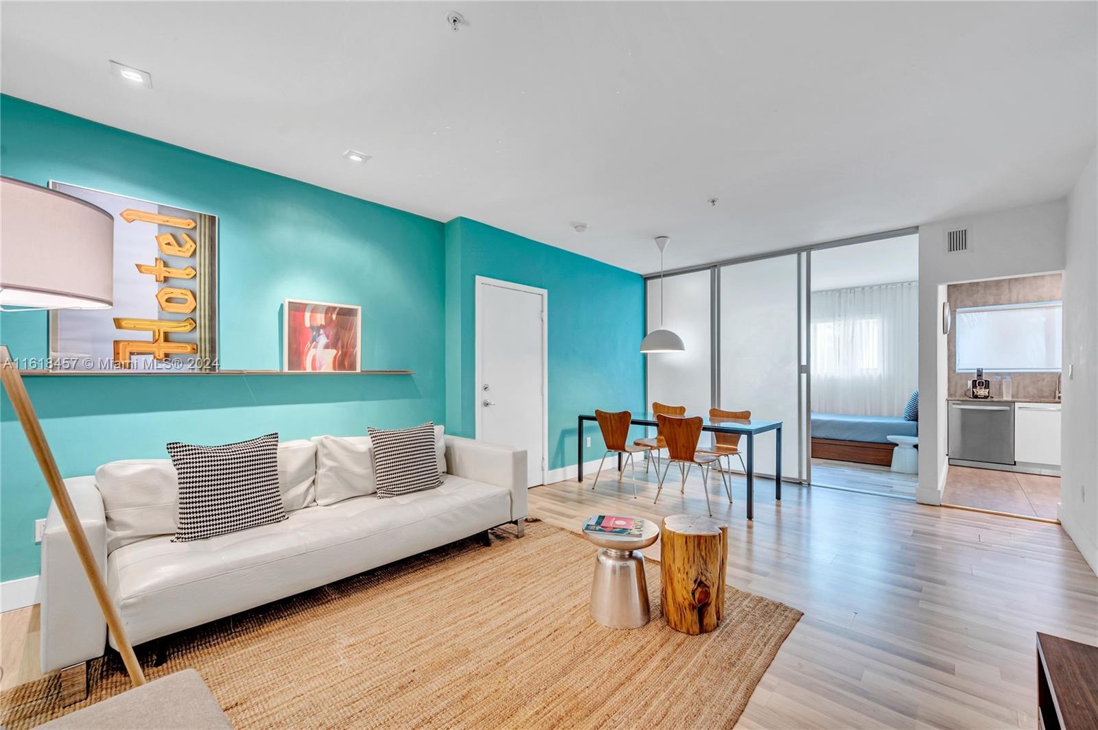 a living room with furniture and wooden floor