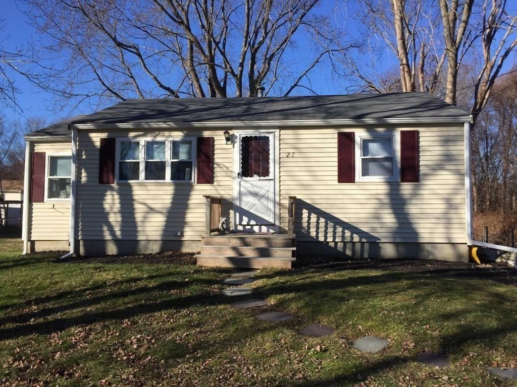 a front view of a house with a yard