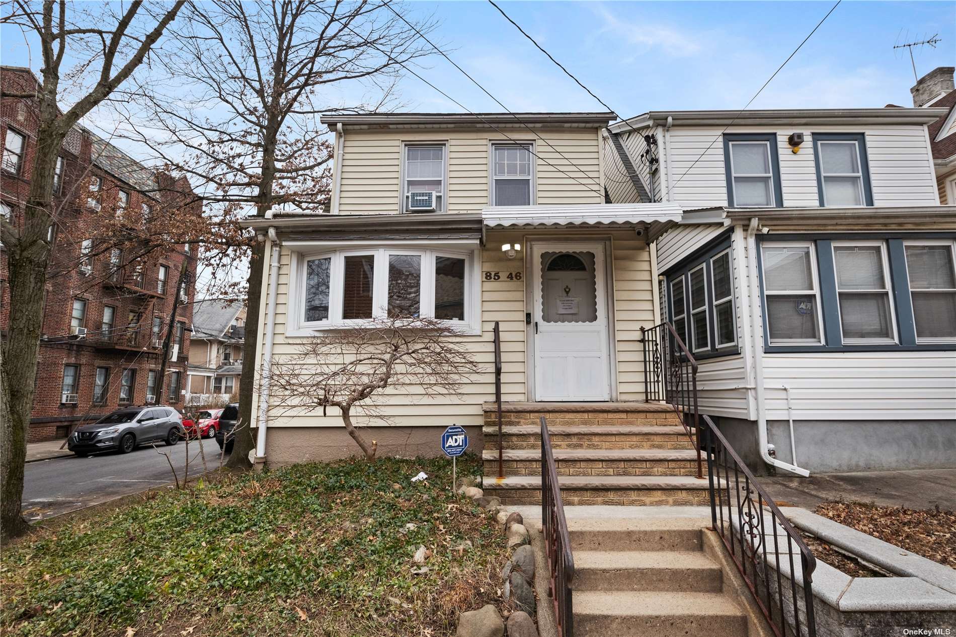 a front view of a house with a yard