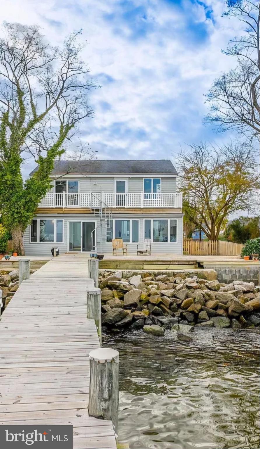 a front view of a house with a ocean view