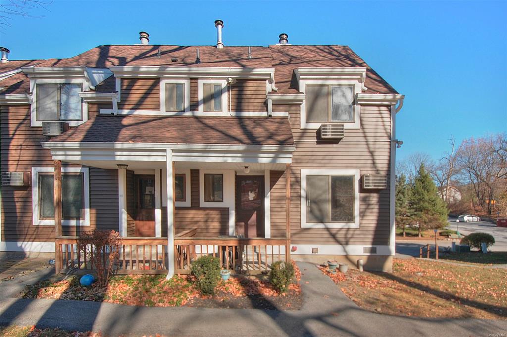 View of property featuring a porch