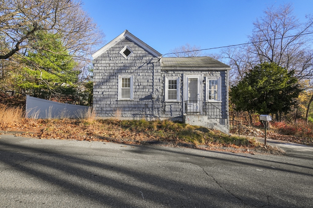 front view of a house with a yard