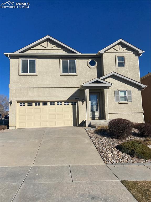 Front of property featuring a garage