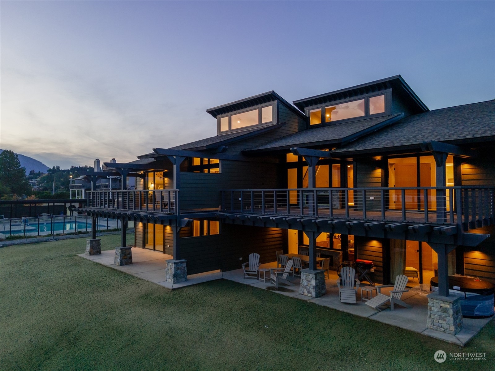 a front view of house with outdoor space and swimming pool