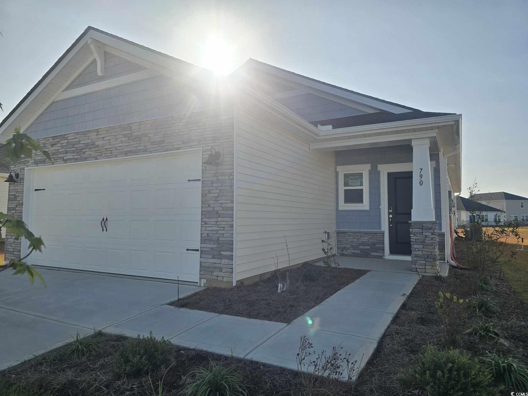 View of front of property with a garage