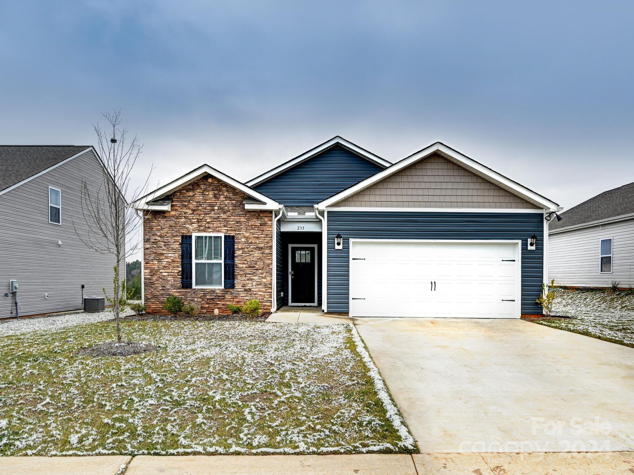 a front view of a house with a yard