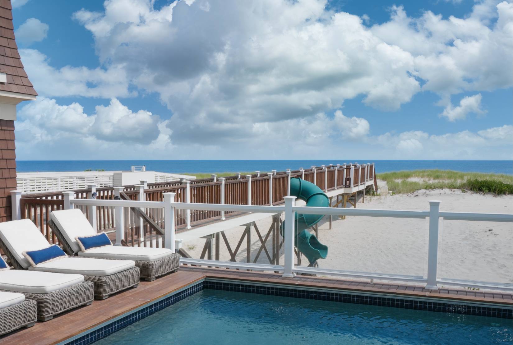 a view of roof deck with furniture