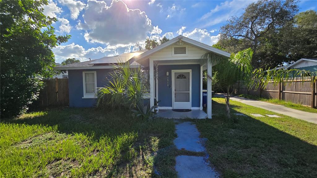 a view of a house with a yard