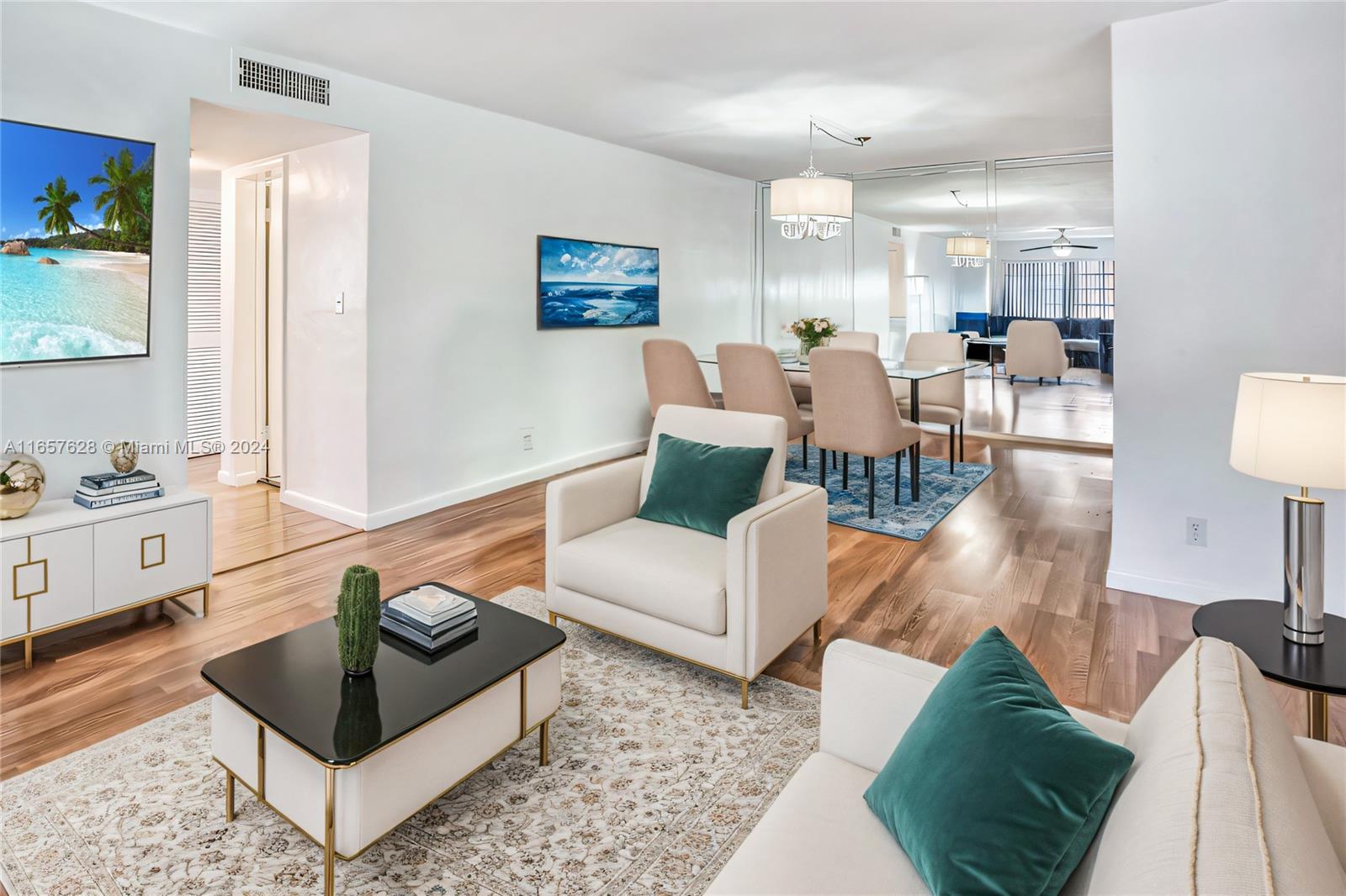 a living room with furniture and wooden floor