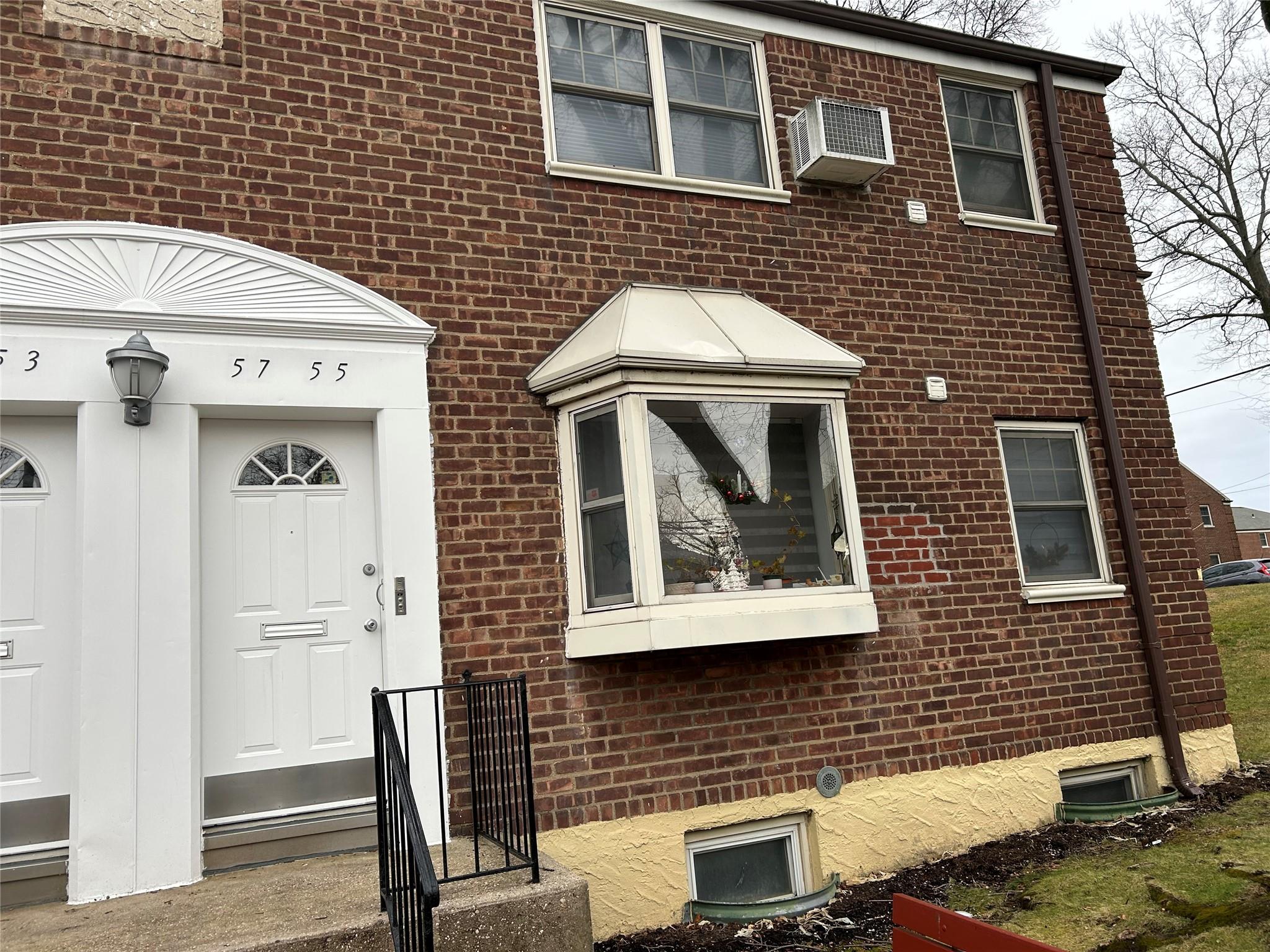 a front view of a house with a door