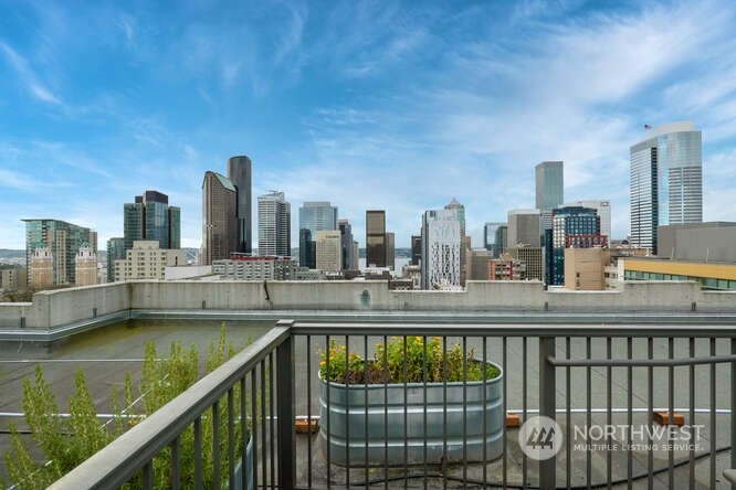 a view of a balcony with city view