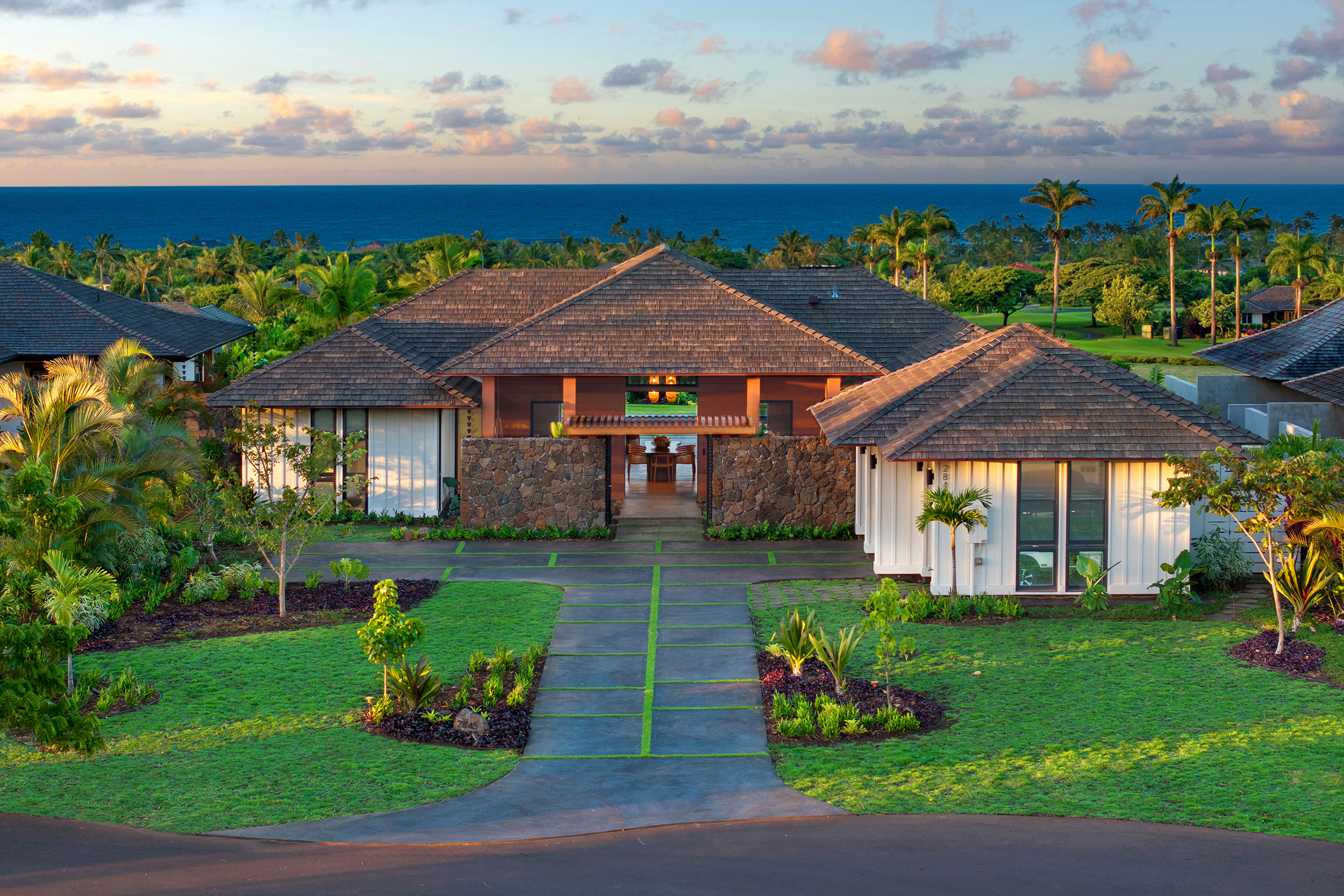 a front view of a house with garden