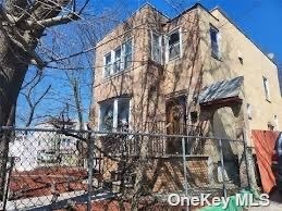 a view of a house with a tree