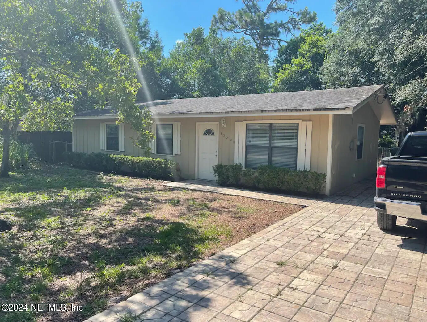 front view of a house with a yard