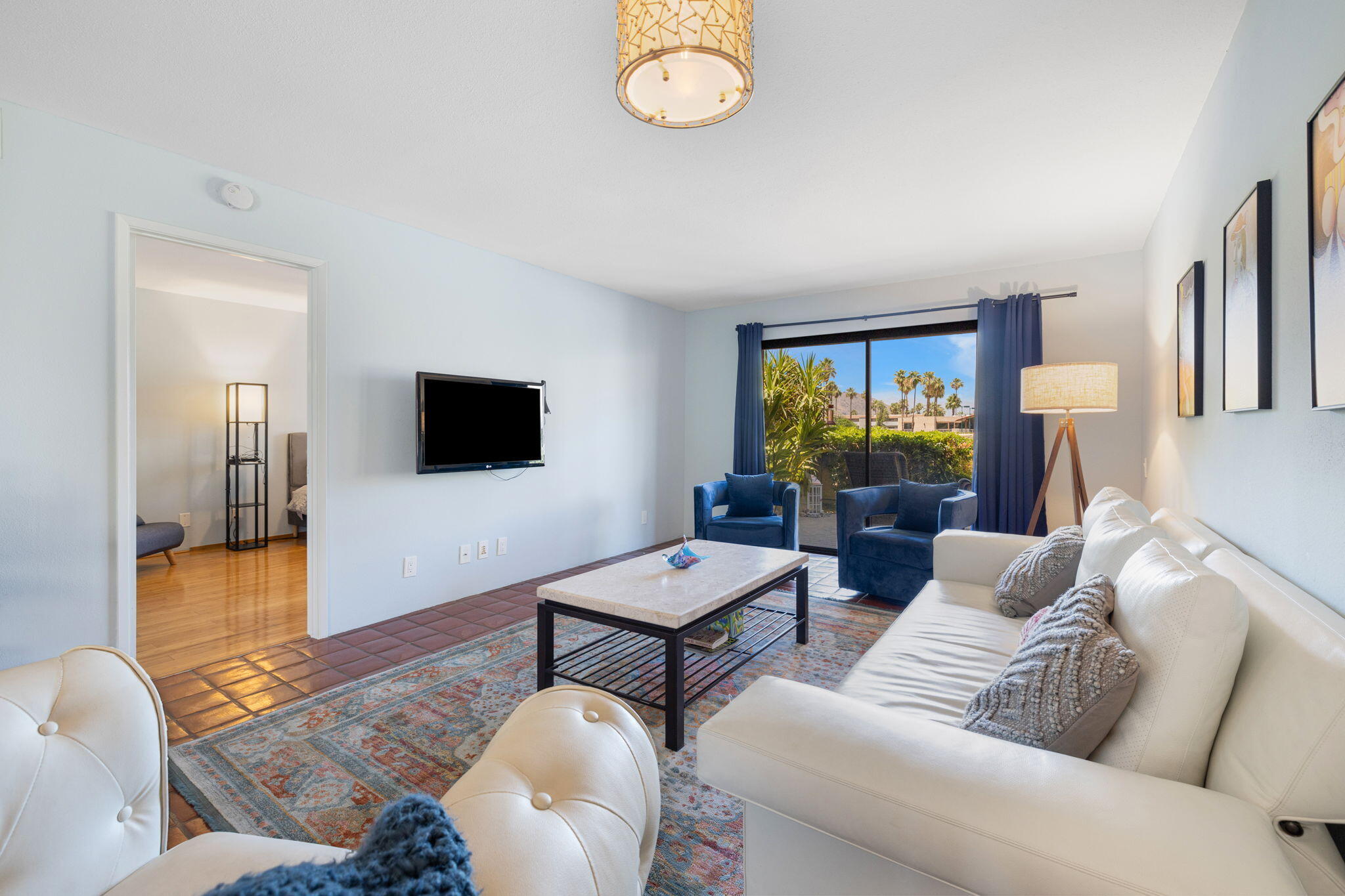 a living room with furniture and a flat screen tv