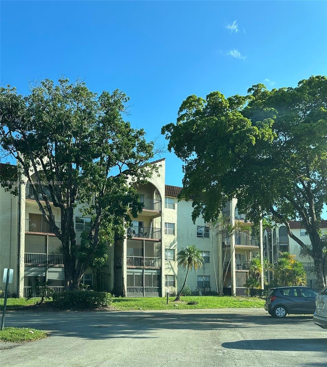 front view of a house with a tree