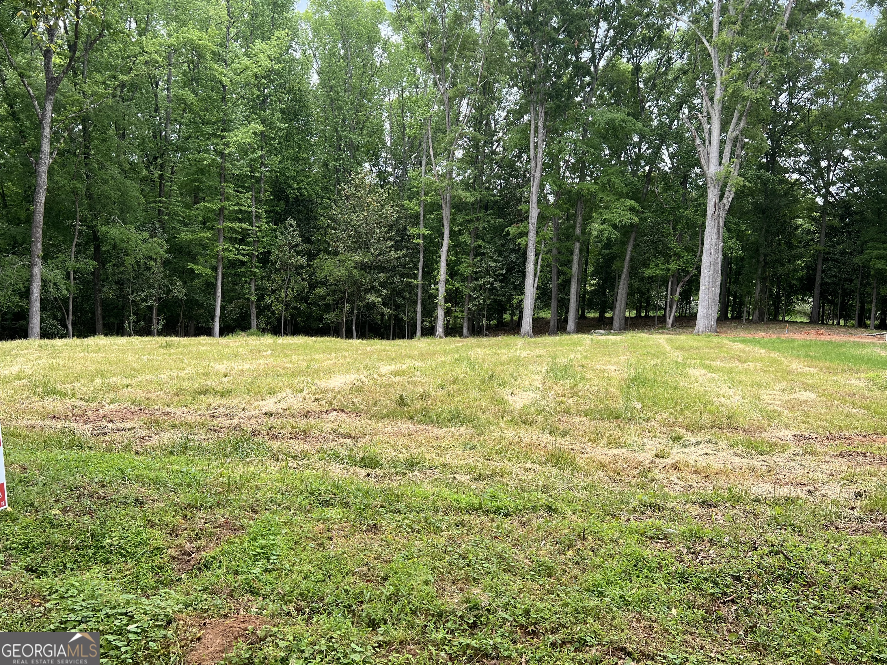 a swimming pool is in the middle of a field