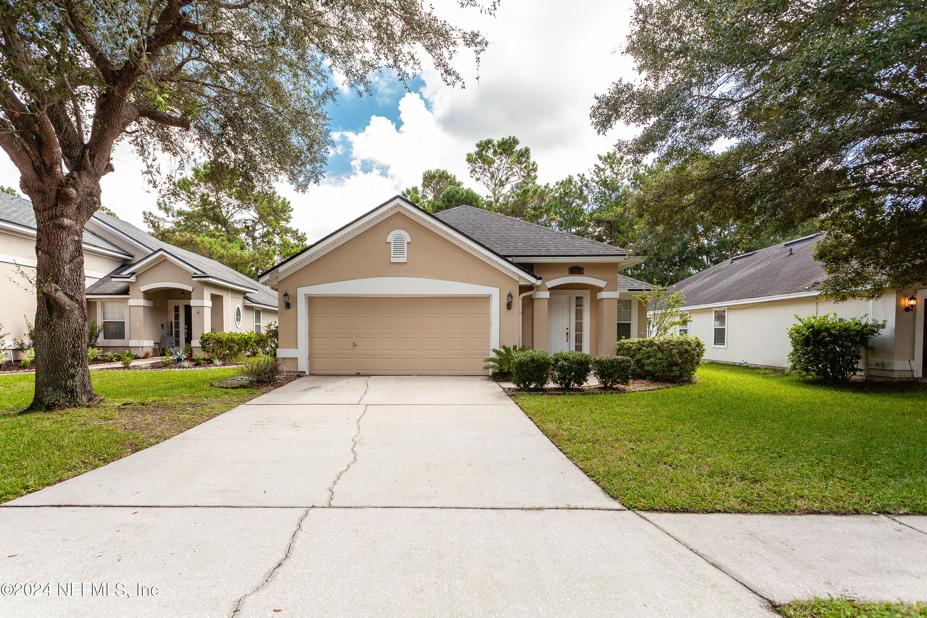 a front view of a house with a yard