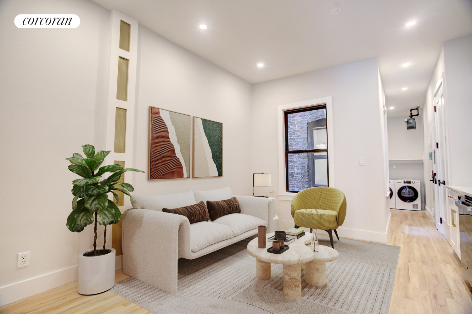 a living room with furniture and a potted plant