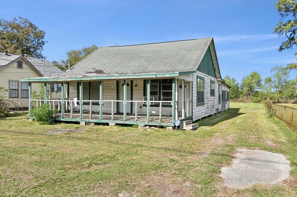 a view of a house with swimming pool and porch