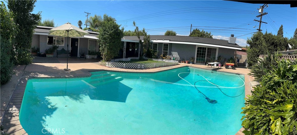 a view of a house with swimming pool