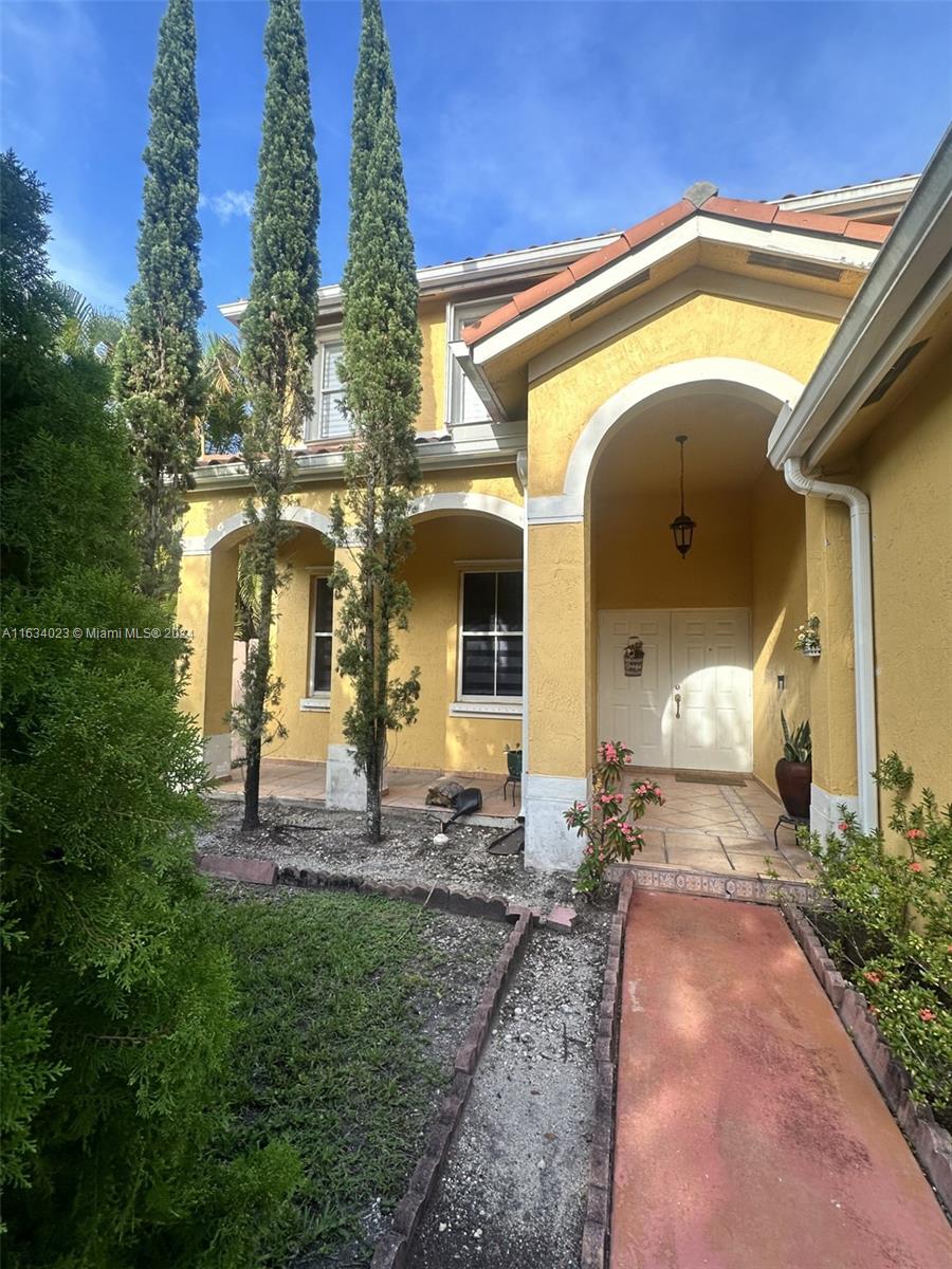 a front view of a house with a yard