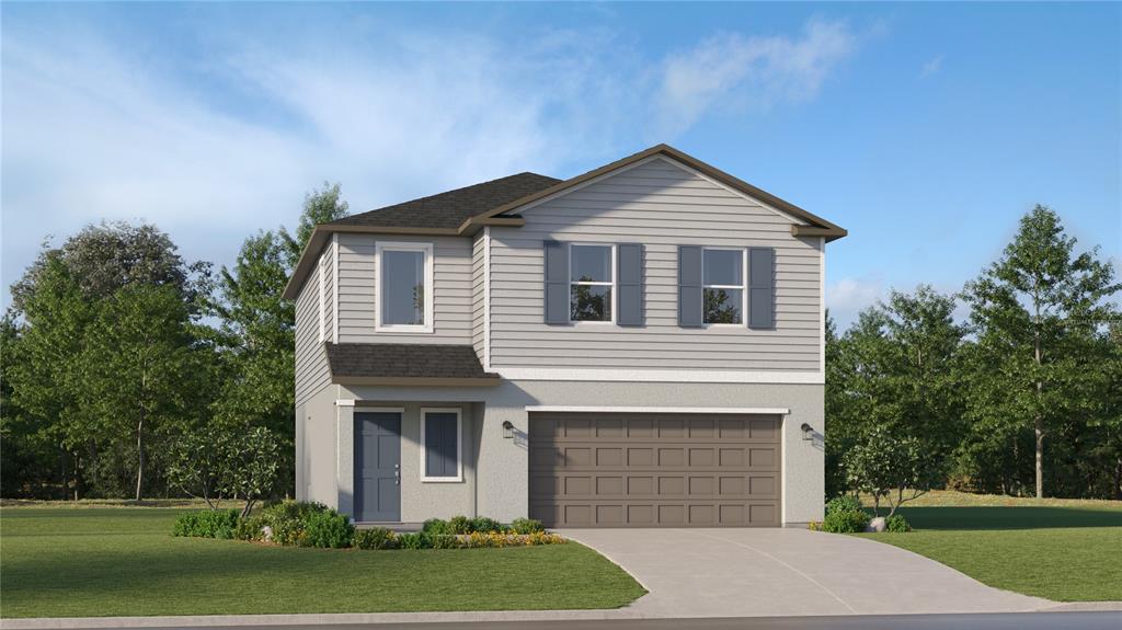 a front view of a house with a yard and garage