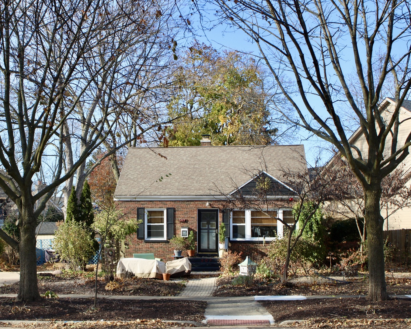 front view of a house with a trees