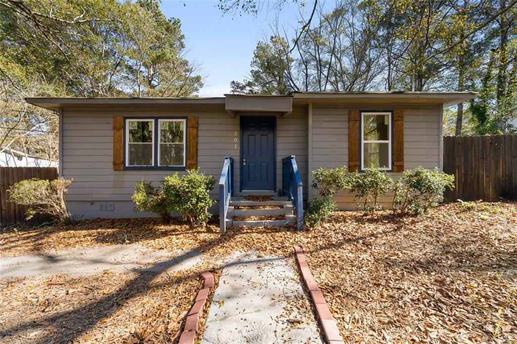 front view of a house with a yard