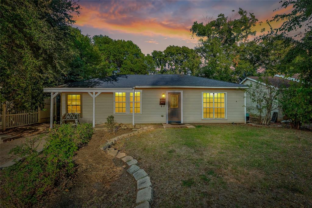 front view of a house with a yard