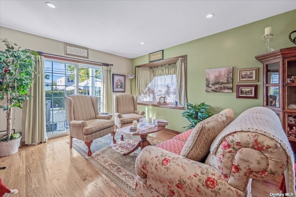 a living room with furniture and large window