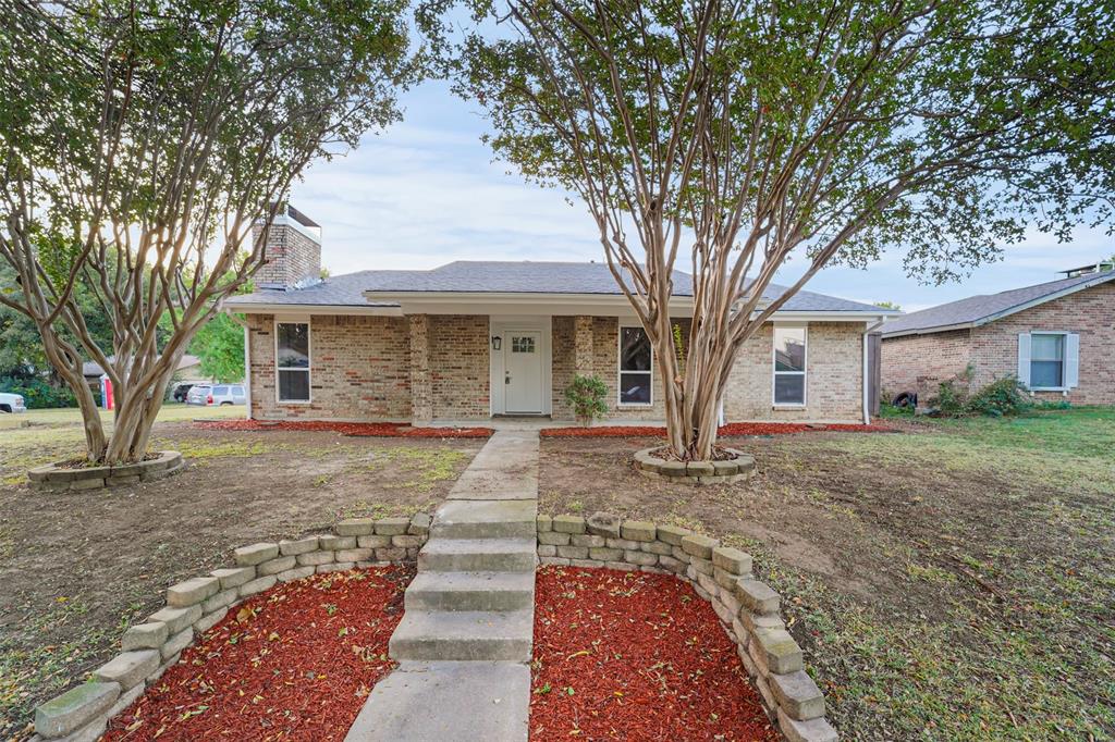 front view of a house with a trees