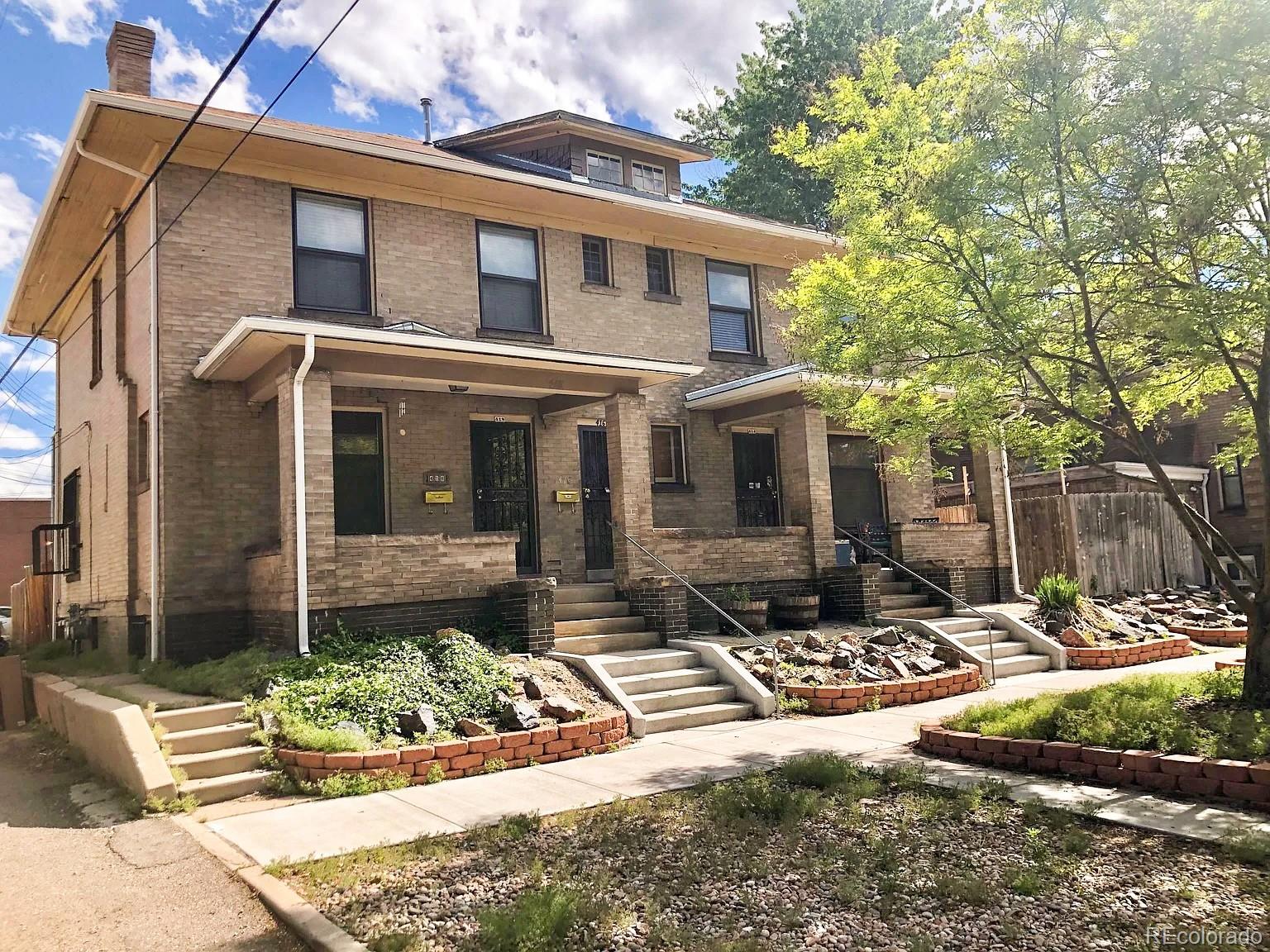 a front view of a house with yard