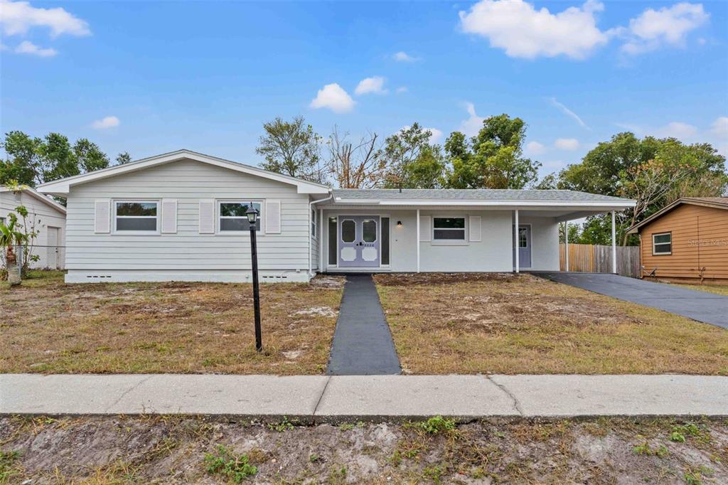 a view of a house with a yard