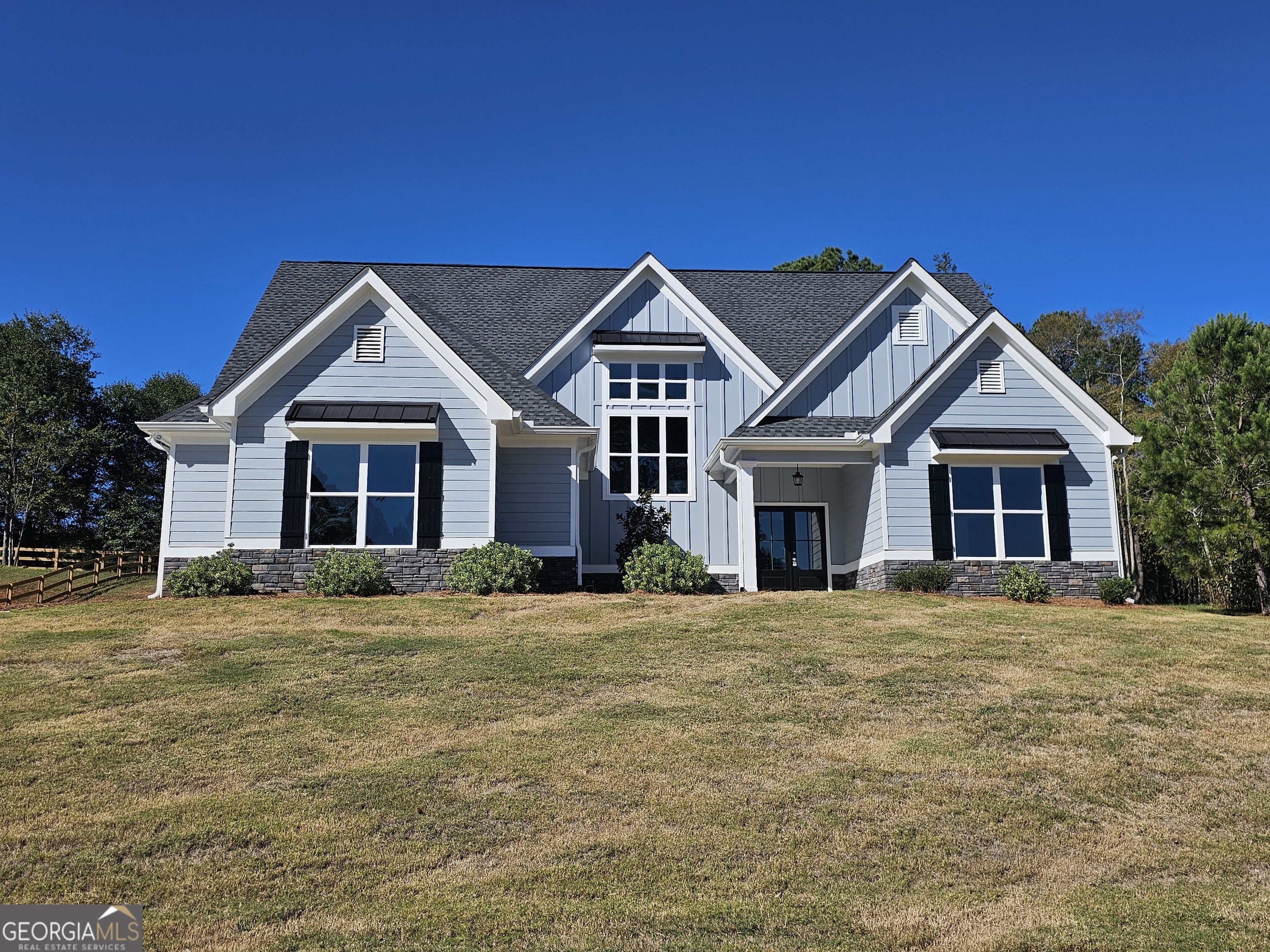 a front view of a house with a yard