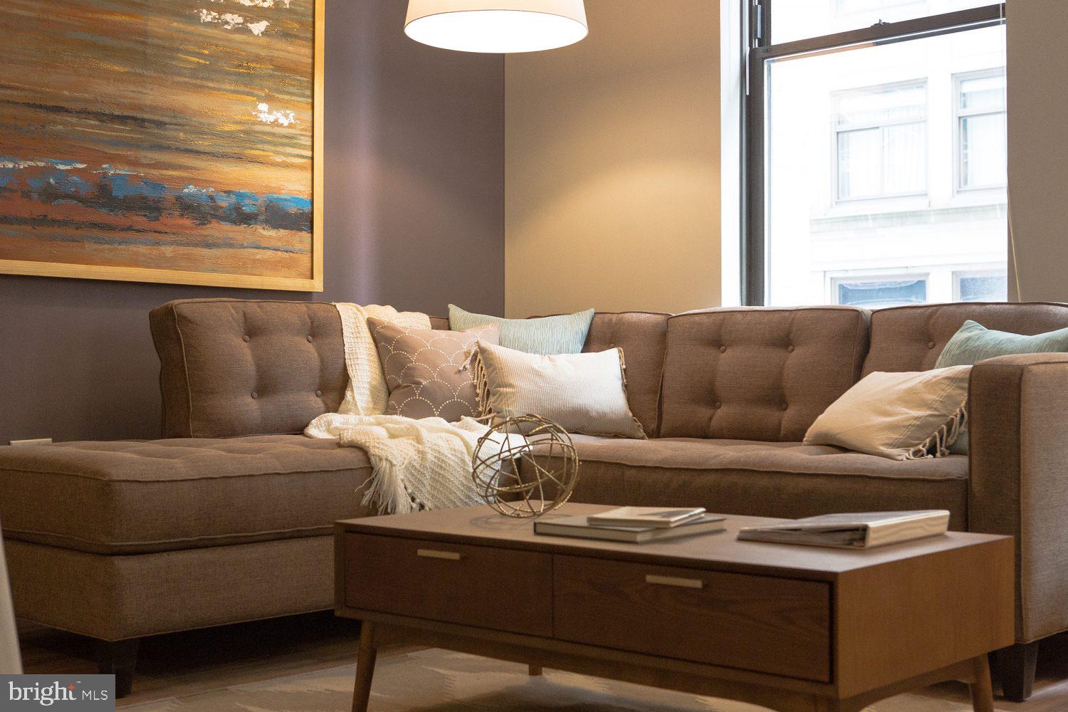 a living room with furniture and a window