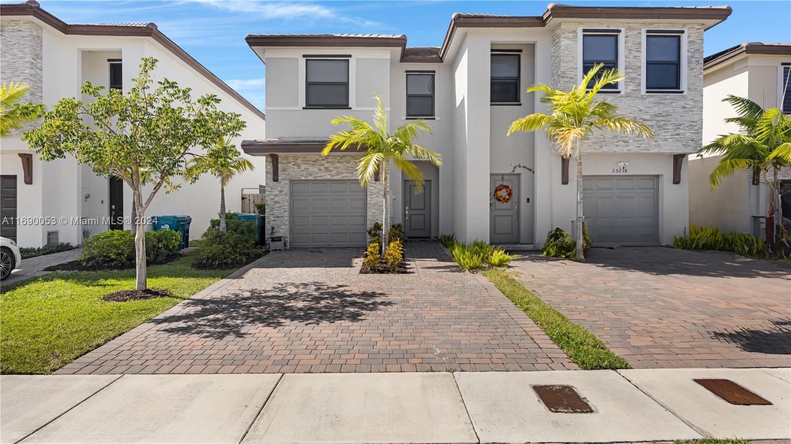 a front view of a house with yard