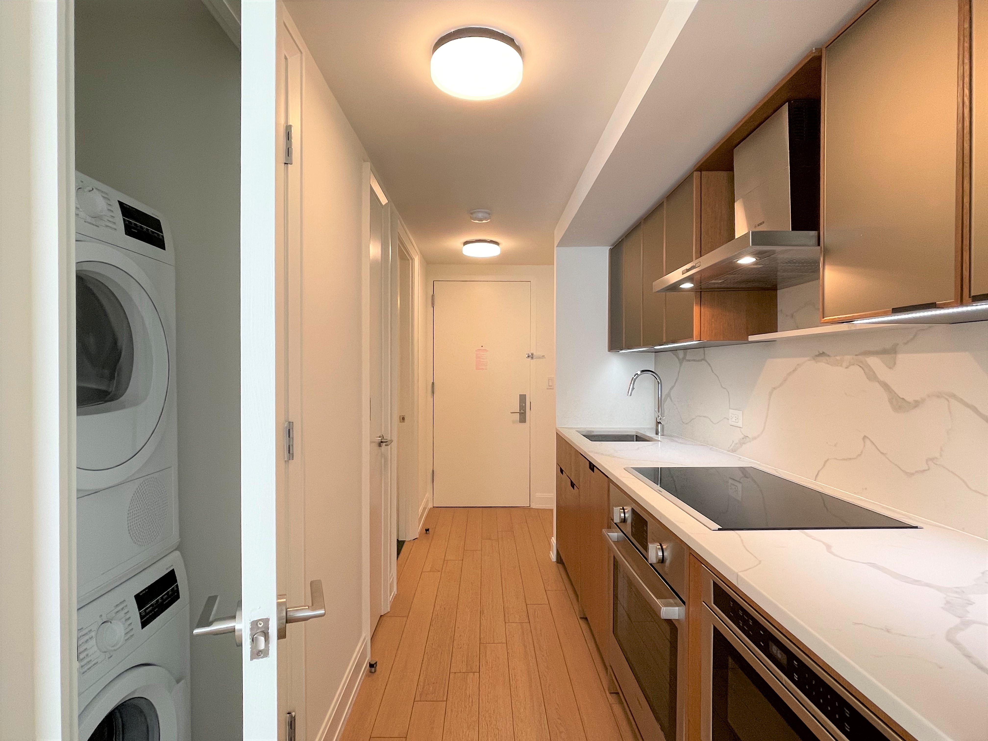 a kitchen with a sink and a refrigerator