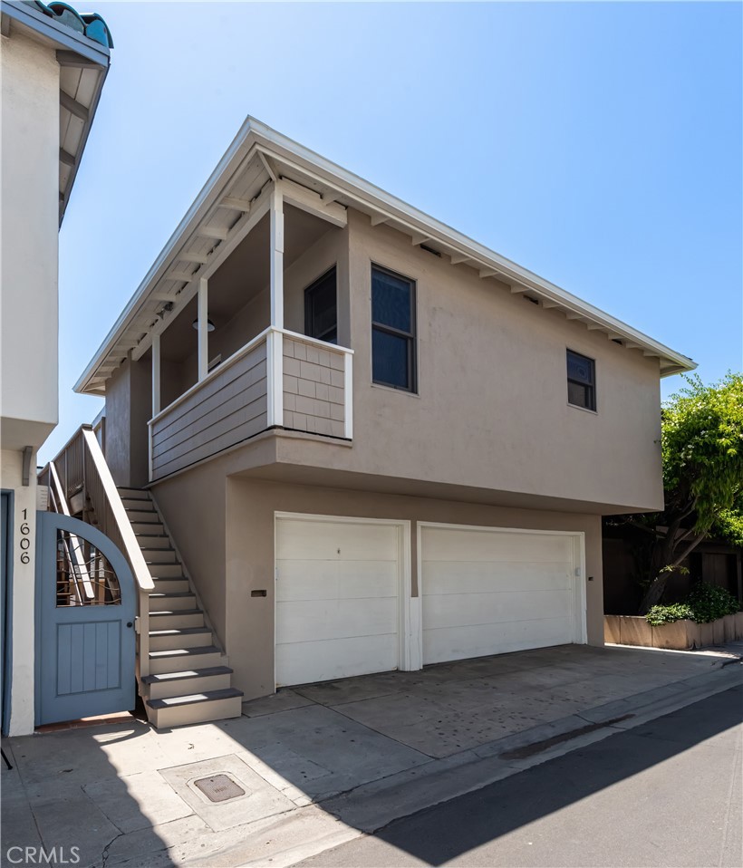 a front view of a house with a garage